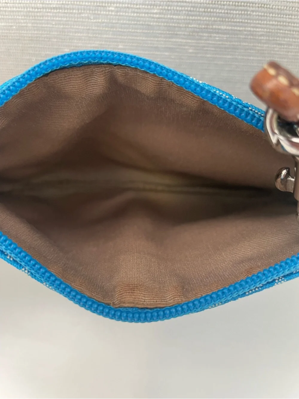 Coach Vintage Wristlet with Suede on the bottom.